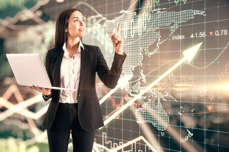 Business investing concept with trader with laptop on digital screen background with growing arrows,...
