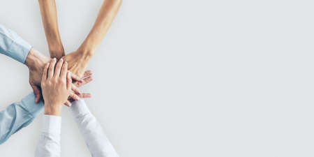 Collaboration concept with human hands of business people on white surface with copyspace. Mock upの写真素材