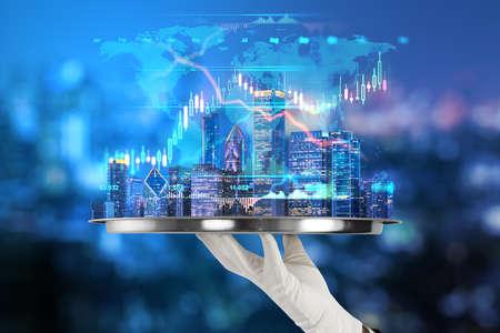 Development and real estate concept with metallic tray in hand with digital growing forex chart...