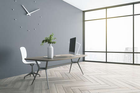 Sunny stylish office room with gray wall, parquet, huge window and wooden table and floor. 3D...