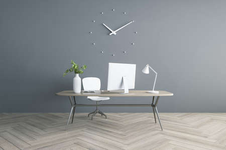Modern workplace in light room with modern computer on stylish table on wooden floor and gray wall. 3D renderingの写真素材