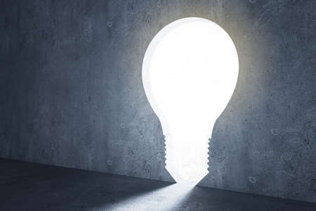 Idea concept with dark wall and light bulb entrance. 3D renderingの写真素材