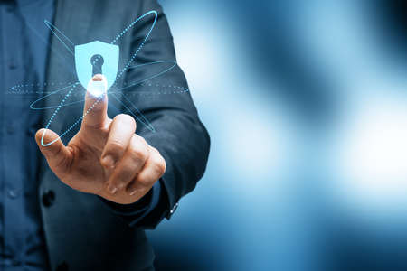 Cyber security concept with businessman touching virtual interface with keyhole