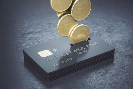 Cashback loyalty programm concept with metal coins bound for a stack of black credit cards on abstract dark surface. 3D renderingの写真素材