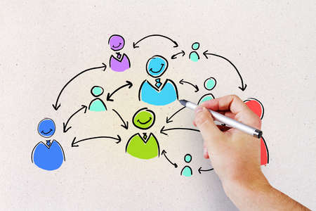 Social network concept with man hand writing sketch with human media icons and arrows between them
