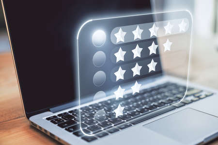 Feedback and rating concept with digital board with star rows on laptop background