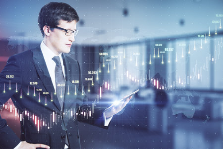 Global trading cocnept with trader looking at digital tablet screen and virtual transparent screen...