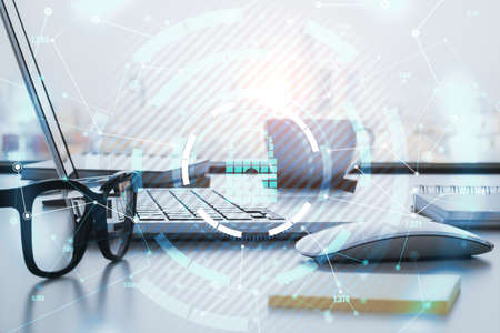 Encircled keylock hologram icon with a laptop and glasses in the background, data safety and...