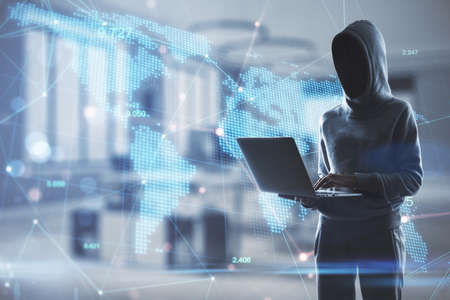 Hacker in blurry office interior using laptop with digital map. Hacking, data and technology...