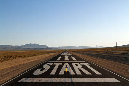 Creative start road on blue sky horizon background. Career development, startup and success conceptの写真素材