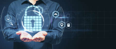 Blank dark backdrop with digital lock symbol above open man palms, personal data security concept....