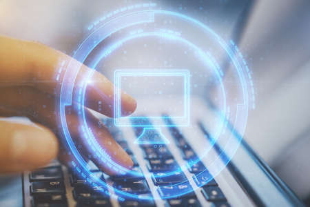 Close up of hand using laptop with glowing computer interface. Technology and digital transformation...