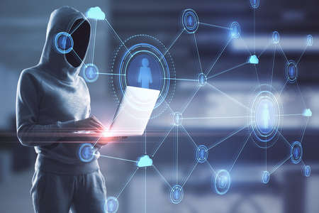 Hacker with laptop and creative glowing blue business interface standing on blurry office background. Hacking and online recruitment concept. Double exposureの写真素材