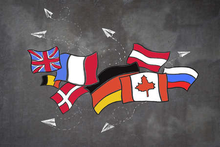 Creative flags sketch with airplanes on concrete wall background. Travel and foreign languages...