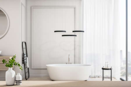 Stylish light shades sunny bathroom with white bath next to big window, behind wooden bathroom countertop with white vase. 3D renderingの写真素材