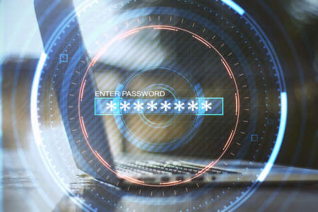 Close up of hand using laptop on blurry desktop background with abstract digital round interface. Verification and technology concept. Double exposureの写真素材