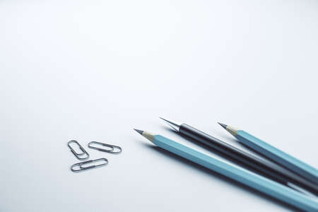 Close up of pencils and paper clips on white mock up layout workplace background, Stationery concept. 3D Renderingの写真素材
