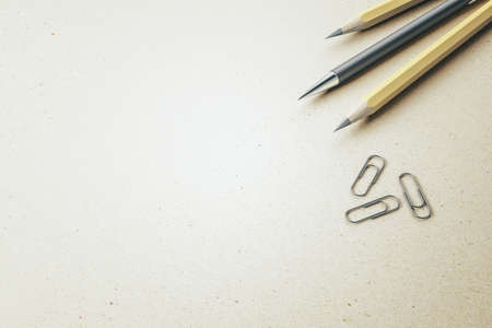 Close up of pencils and paper clips on white mockup table background, Stationery concept. 3D Renderingの写真素材