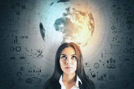 Portrait of attractive young europea businesswoman with creative business sketch and globe hologram...