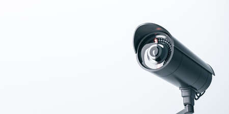 Wide close up image of cctv camera on light background with mock up place for your text and...
