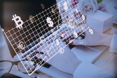 Close up of female hands at desk using laptop with abstract glowing money mesh on blurry background....