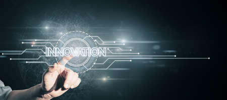 Hand pointing at creative glowing digital hud interface background with circuit and polygonal mesh network. Innovation, future and artificial intelligence conceptの写真素材