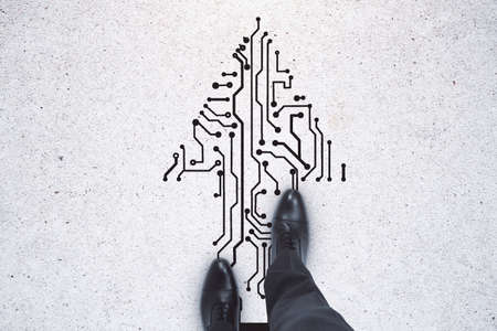Top view of businessman feet standing on abstract circuit arrow sketch on white ground background with mock up place. Success and digital transformation conceptの写真素材