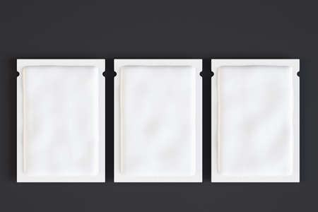 Three empty white product packets on dark background. Mock up, 3D Renderingの写真素材