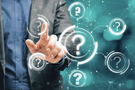 Close up of male hand pointing at abstract glowing question marks interface on blurry bokeh background. Technology, faq, online help, problem solution concept. Double exposureの写真素材