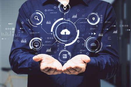 Man hands holding abstract business interface on blurry background. Cloud computing, technology and...