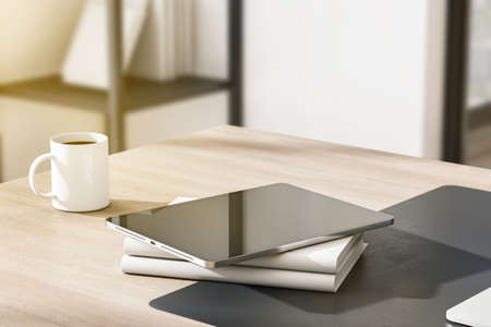 Close up of empty tablet with reflections, coffee cup and other items on wooden outdoor workplace...