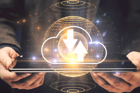 Close up of businessman hands holding tablet with abstract cloud hologram with arrows. Computing,...
