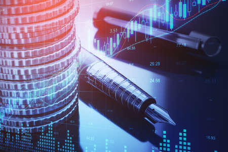Close up of stacked coins, pen and forex chart on blurry desktop background. Financial management, money and data concept. Double exposureの写真素材