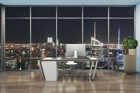 Minimalistic designer office interior with workplace, night city view and other items. 3D Renderingの写真素材