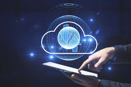 Businessman hand pointing at tablet with abstract digital globe with cloud and arrows. Cloud...