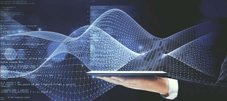Close up of businessman hand holding tablet with abstract coding and digital web hologram on blue...