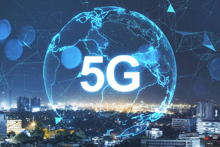 Globe with 5G hologram on blurry night city background. Technology, data and future concept. Double exposureの写真素材