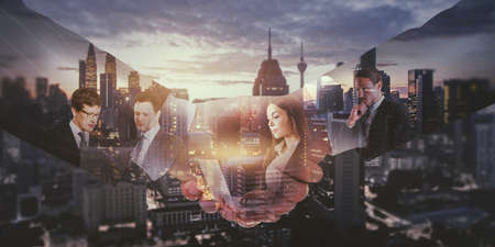 Creative handshake with businesspeople working on bright city background. Teamwork and cooperation...