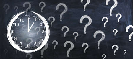 Creative clock and question marks sketch on chalkboard wall backdrop. Time management and deadline...