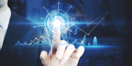 Businessman hand pointing at creative glowing business graph on blurry background. Innovation,...