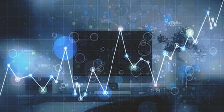 Close up of workplace with computer monitor and abstract glowing business chart on blurry grid...