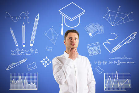 Portrait of thoughtful young european business man with creative knowledge and graduation sketch on...