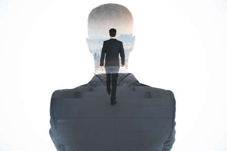 Abstract image of attractive european business man walking on abstract stairs on white background with mock up place. Success and career growth concept. Double exposureの写真素材