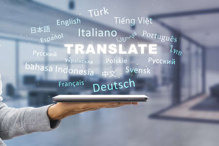Close up of hand holding tablet with abstract text on blurry office interior background. Translation, foreign language, service and education concept. Double exposureの写真素材