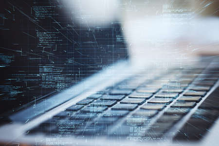 Close up of laptop with abstract glowing coding big data interface on blurry background. Technology...