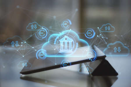 Close up of tablet with abstract glowing cloud computing and online banking hologram with various...