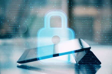 Close up of tablet with abstract glowing padlock interface on blurry outdoor background. Safety,...