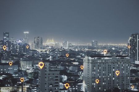 Abstract night city background with glowing location marks and mock up place in sky. Smart city and gps conceptの写真素材