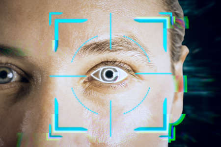 Portrait of attractive young european businessman with abstract glowing face recognition interface....