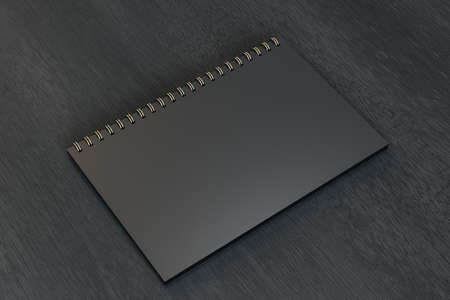 Close up of blank black spiral notepad on dark wooden background. Mock up, 3D Rendering